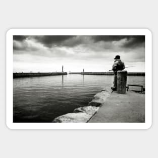 A boy fishing in the harbour at Whitby - Yorkshire, UK Sticker